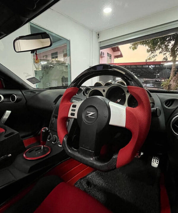 CF Steering for 350z installed. Specs: Top round Galaxy LED Carbon Fiber Steering