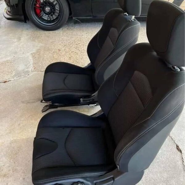 Pair of 370z seats with airbags still in them