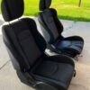 Pair of 370z seats with airbags still in them