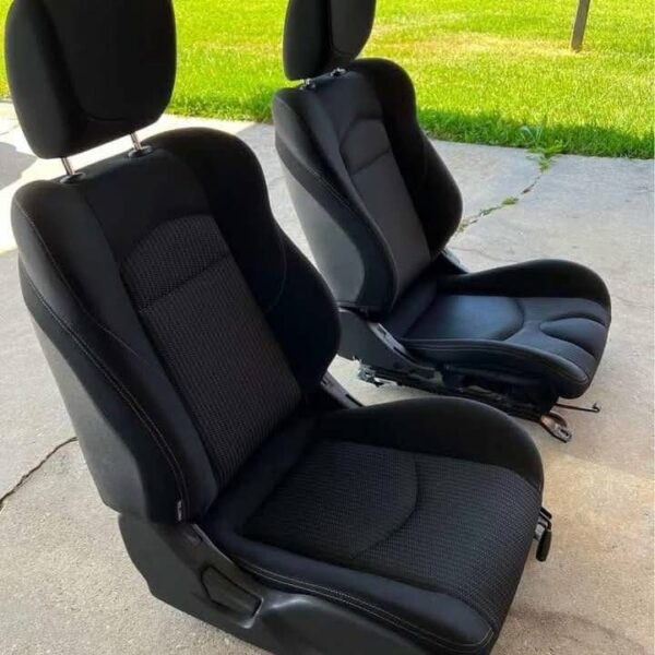 Pair of 370z seats with airbags still in them