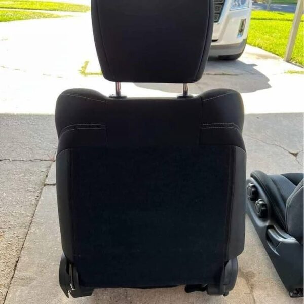 Pair of 370z seats with airbags still in them